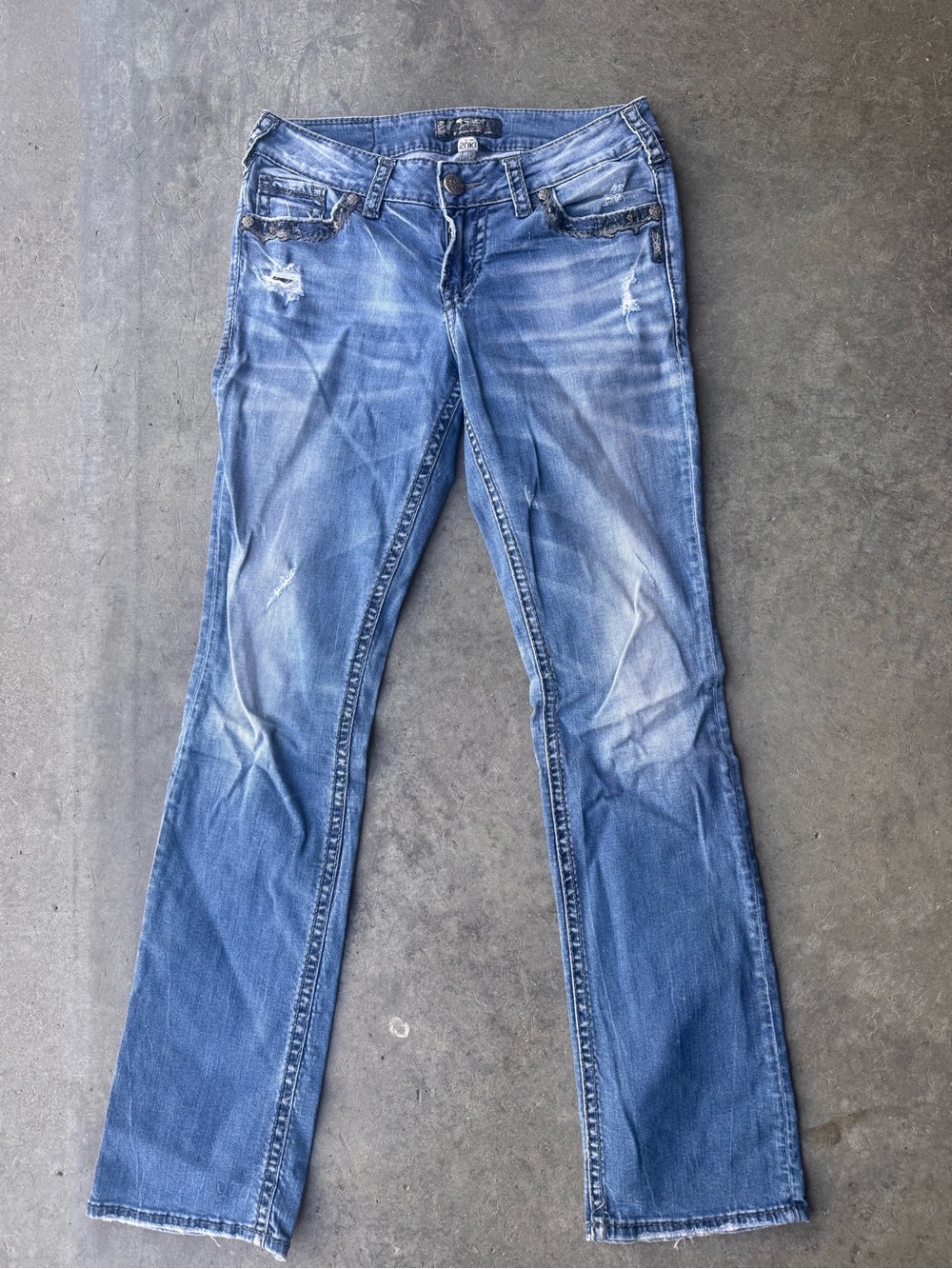 Silver Jeans Women's Faded Blue Flare Jeans with Distressed Details